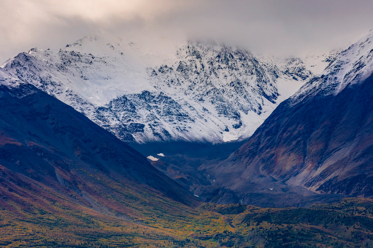 Jagged Peaks of Snow and Stone Under Clear Blue Skies
