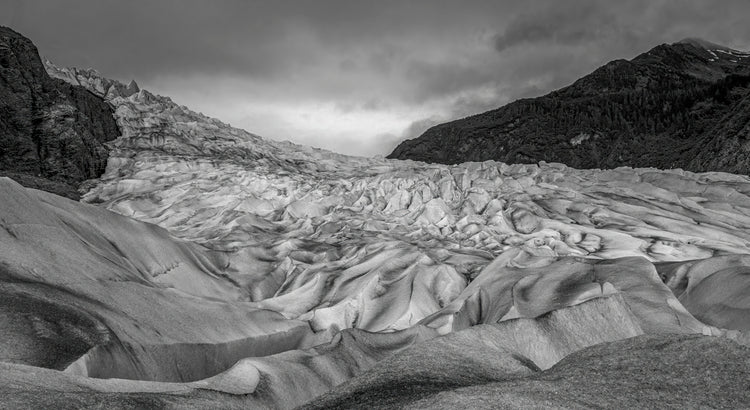 Monochrome Glacier Under Moody Skies