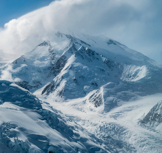Shrouded Alpine Peaks and Glacial Valleys in Deep Winter
