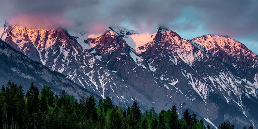 Blushing Peaks Beneath Brooding Skies
