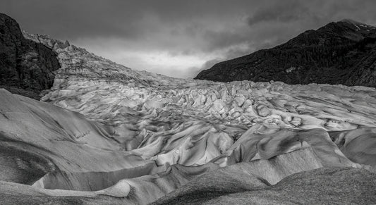 Chiseled Glacier Textures Under Stormy Skies