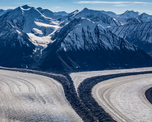 Glacial Pathways Through Towering Peaks