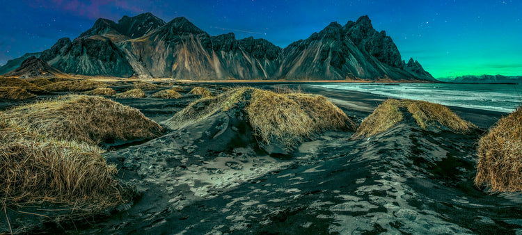 Glacial Wall Beneath an Aurora Veil