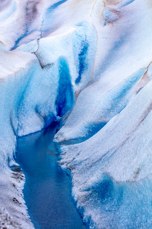 Close-up of a glacier with blue ice and crevasses