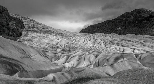 Monochrome Glacier Under Moody Skies